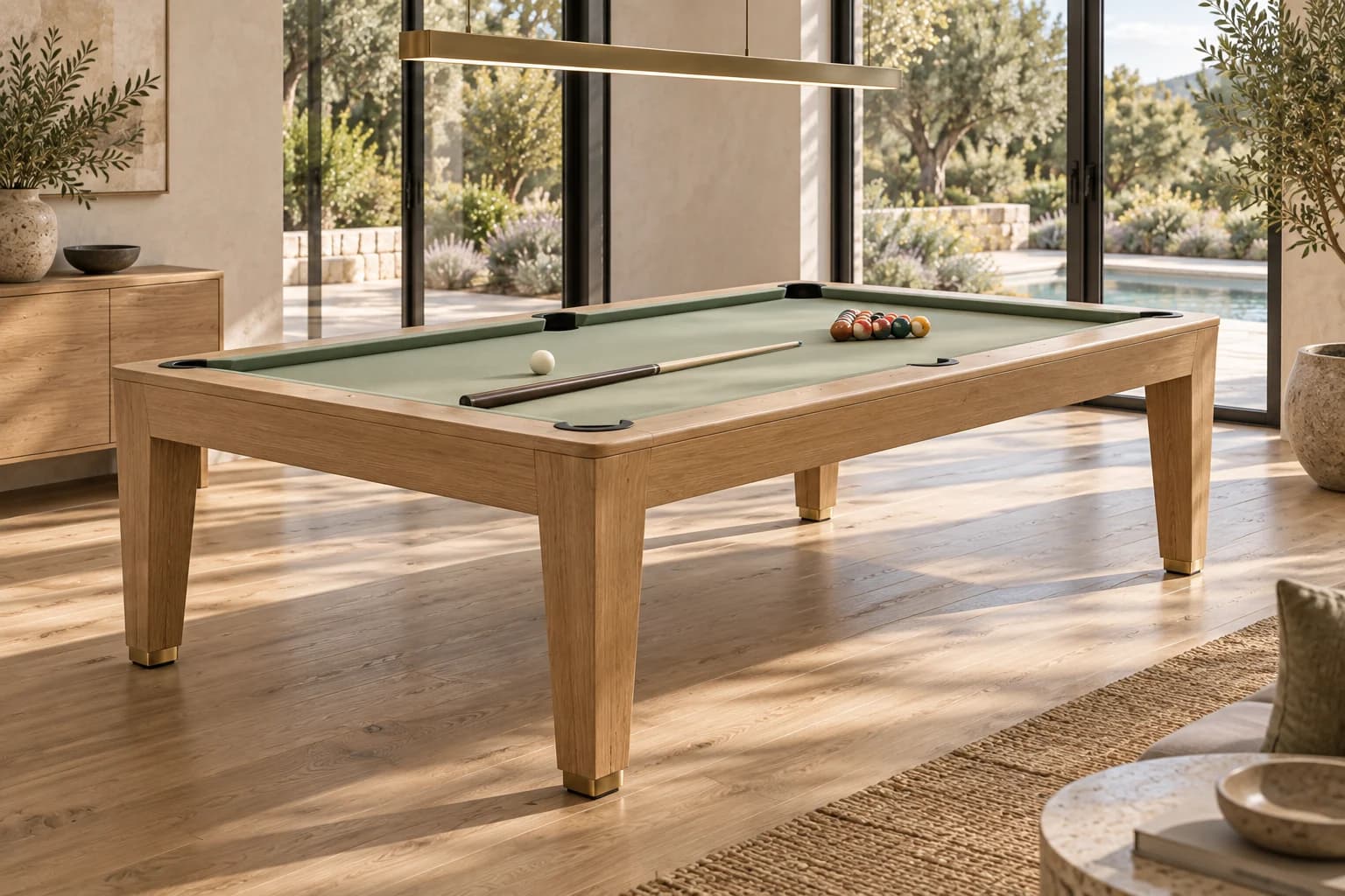 Oak pool table with green cloth in a light garden-facing room