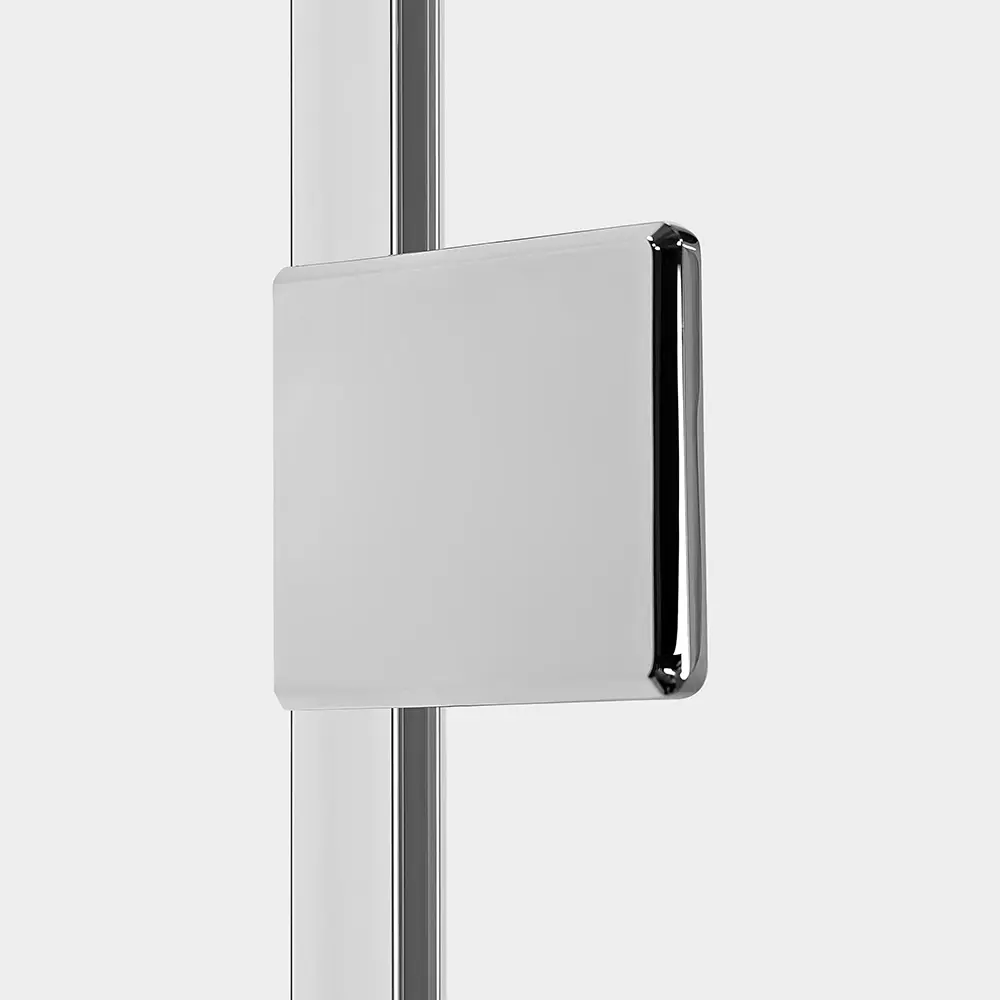 Polished metal mounting block on clear shower glass